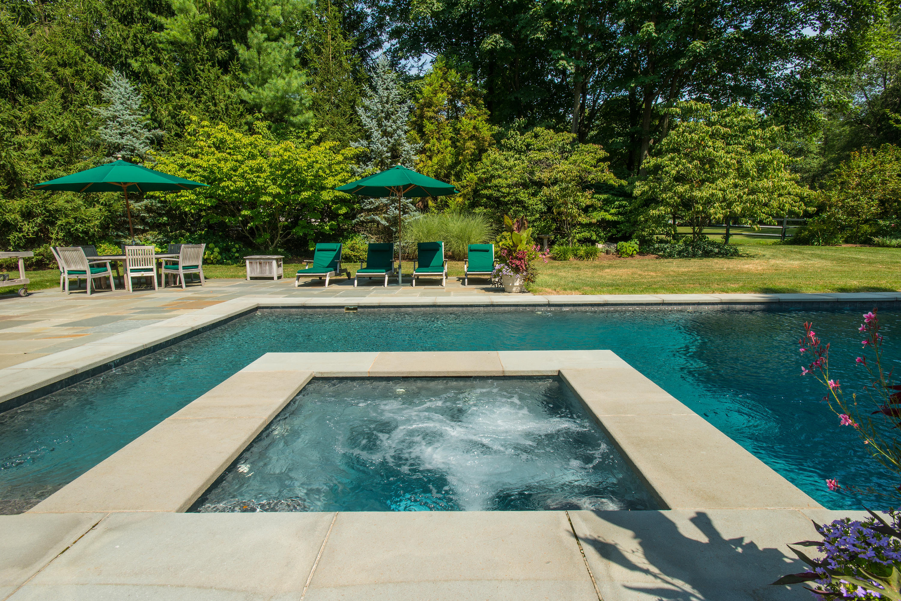 249 Nod Hill Road Wilton, CT 06897 - Photo 30 of 35 a view of a swimming pool with a patio