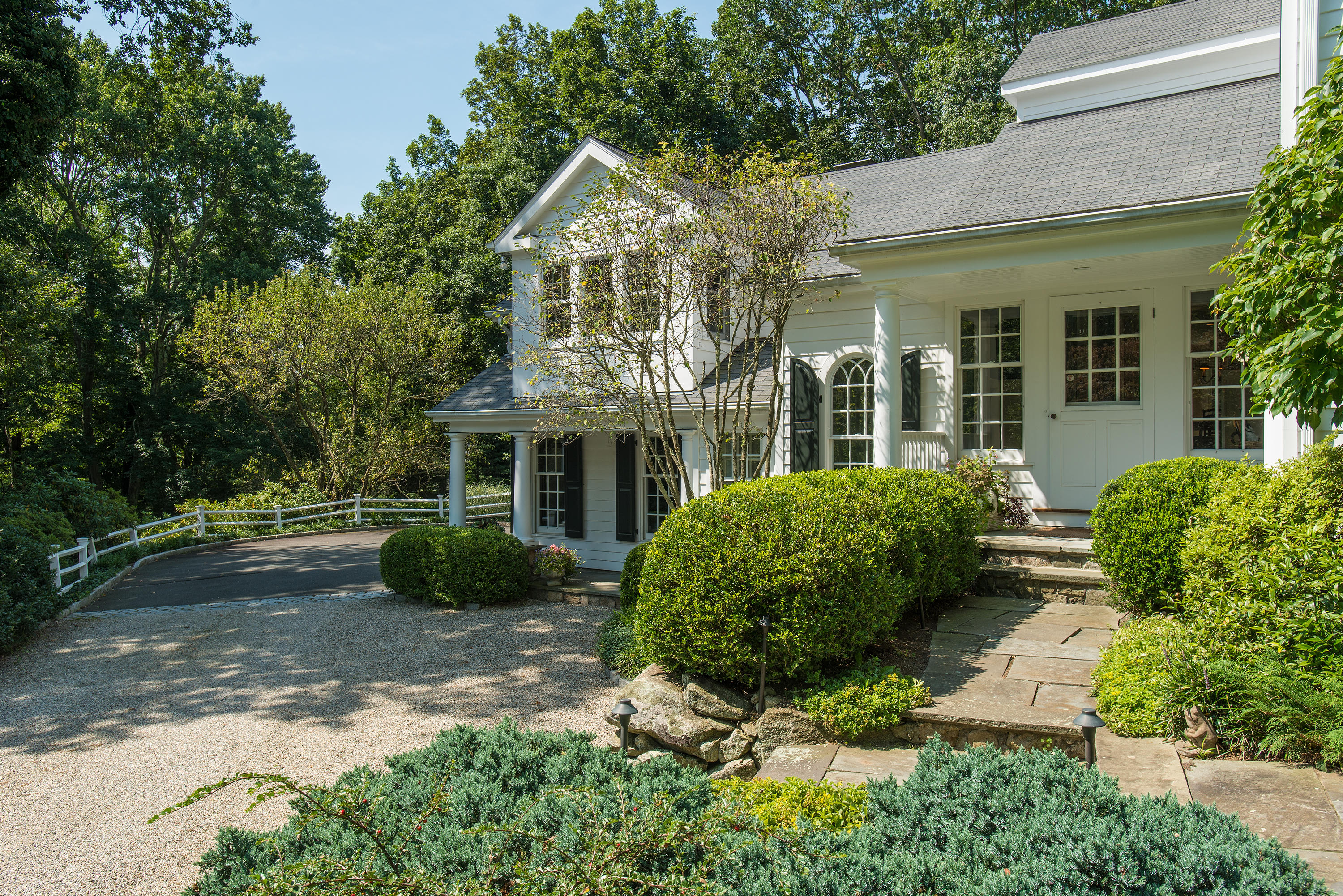 249 Nod Hill Road Wilton, CT 06897 - Photo 3 of 35 a front view of a house with garden