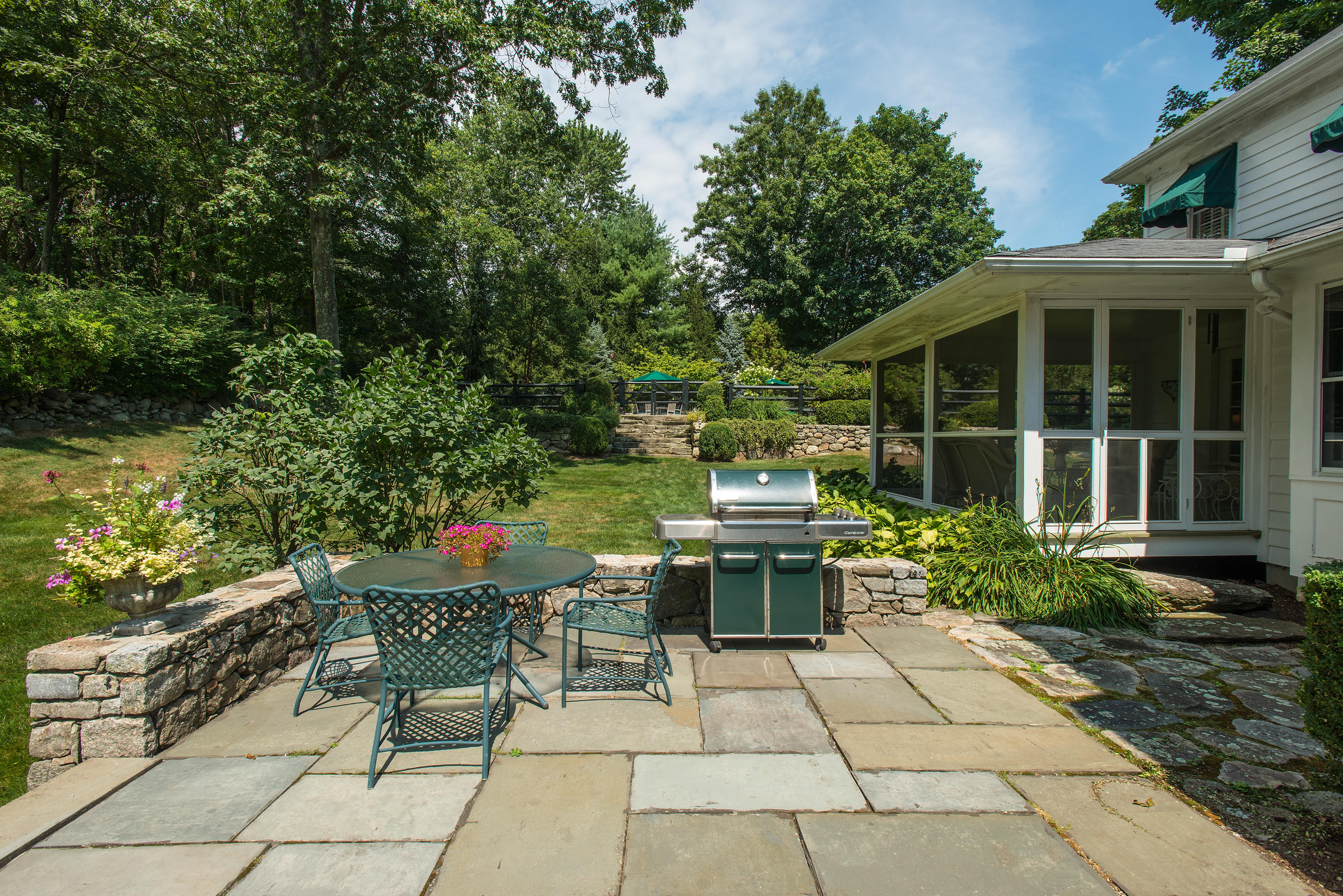 249 Nod Hill Road Wilton, CT 06897 - Photo 32 of 35 a backyard of a house with outdoor seating