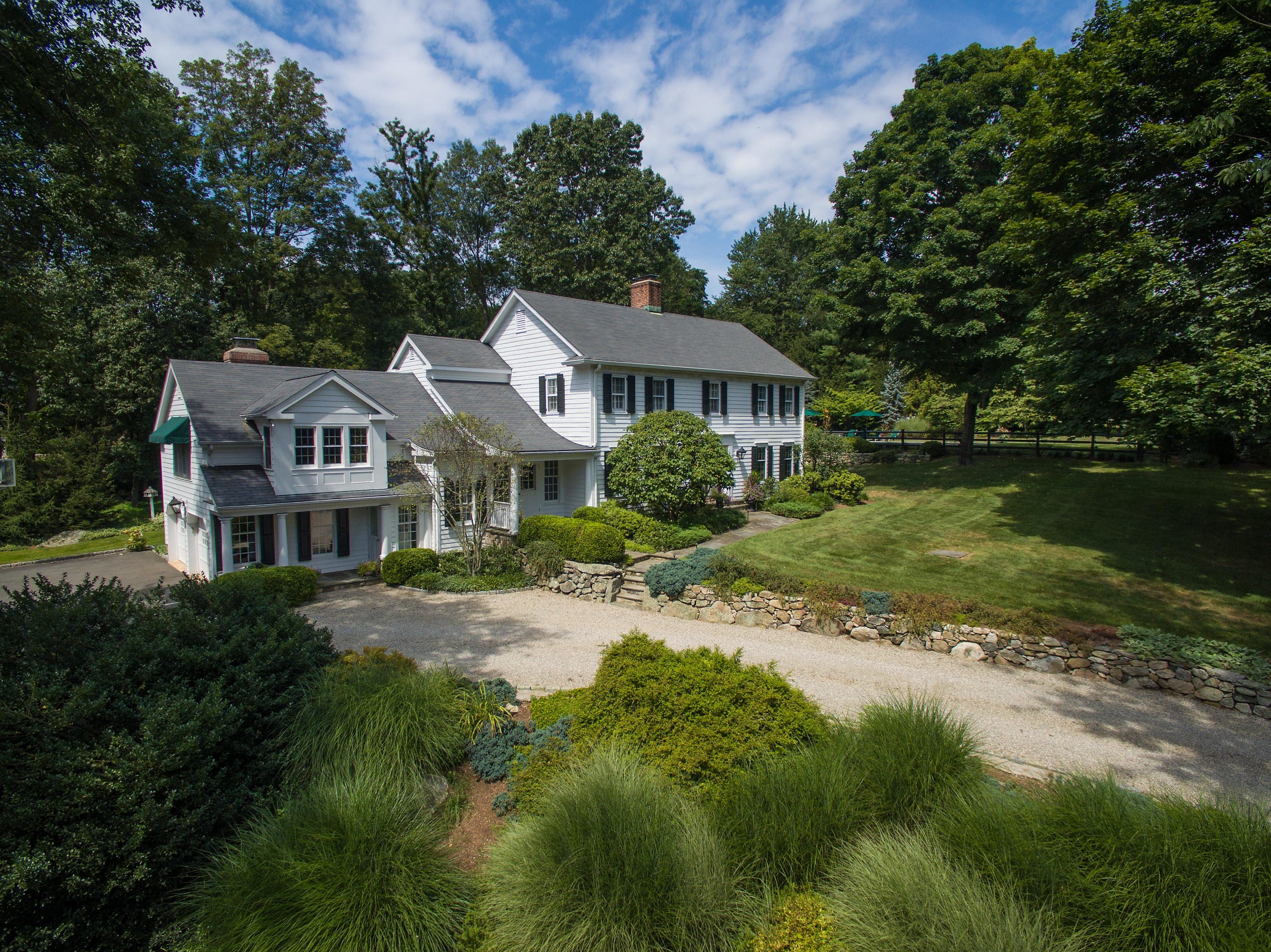 249 Nod Hill Road Wilton, CT 06897 - Photo 33 of 35 a view of a house with a garden