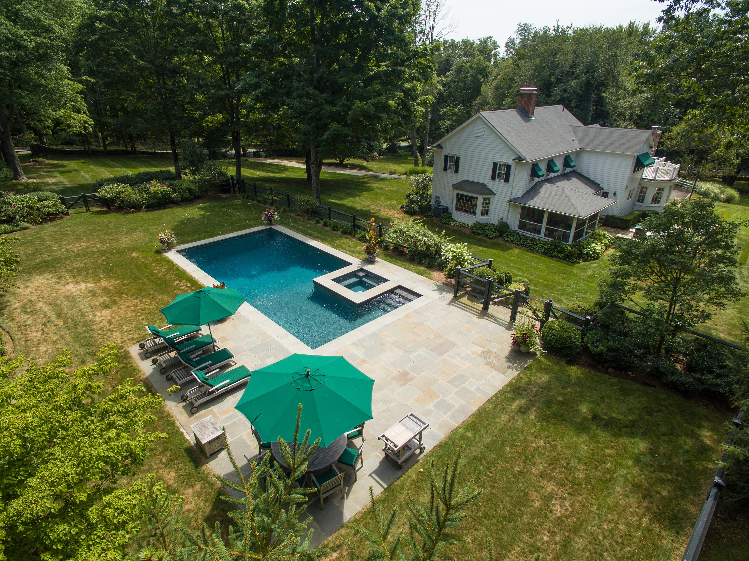 249 Nod Hill Road Wilton, CT 06897 - Photo 5 of 35 an aerial view of a house with swimming pool a yard and lake view