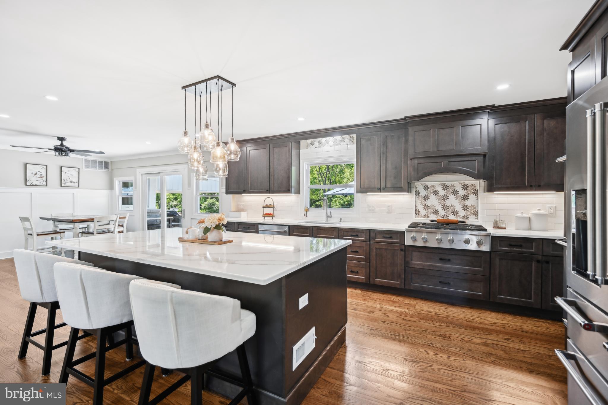 130 Silver Lake Road Bridgeton, NJ 08302 - Photo 13 of 66 a kitchen with stainless steel appliances granite countertop a sink a stove and chairs