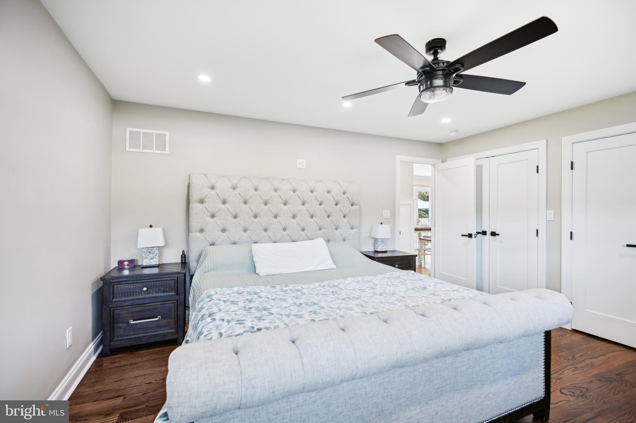 130 Silver Lake Road Bridgeton, NJ 08302 - Photo 19 of 66 a bedroom with a large bed and a chandelier