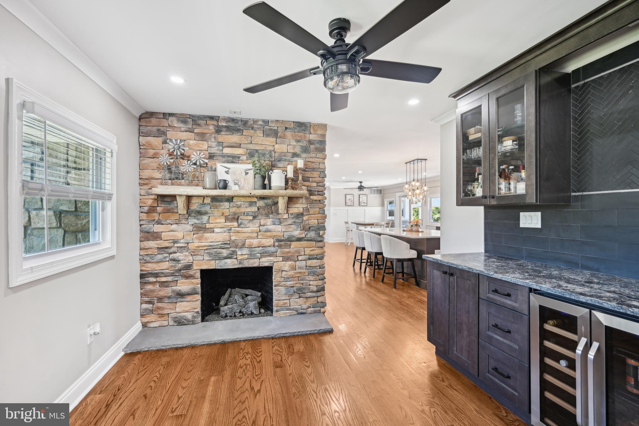 130 Silver Lake Road Bridgeton, NJ 08302 - Photo 22 of 66 a living room with stainless steel appliances granite countertop furniture wooden floor and a fireplace