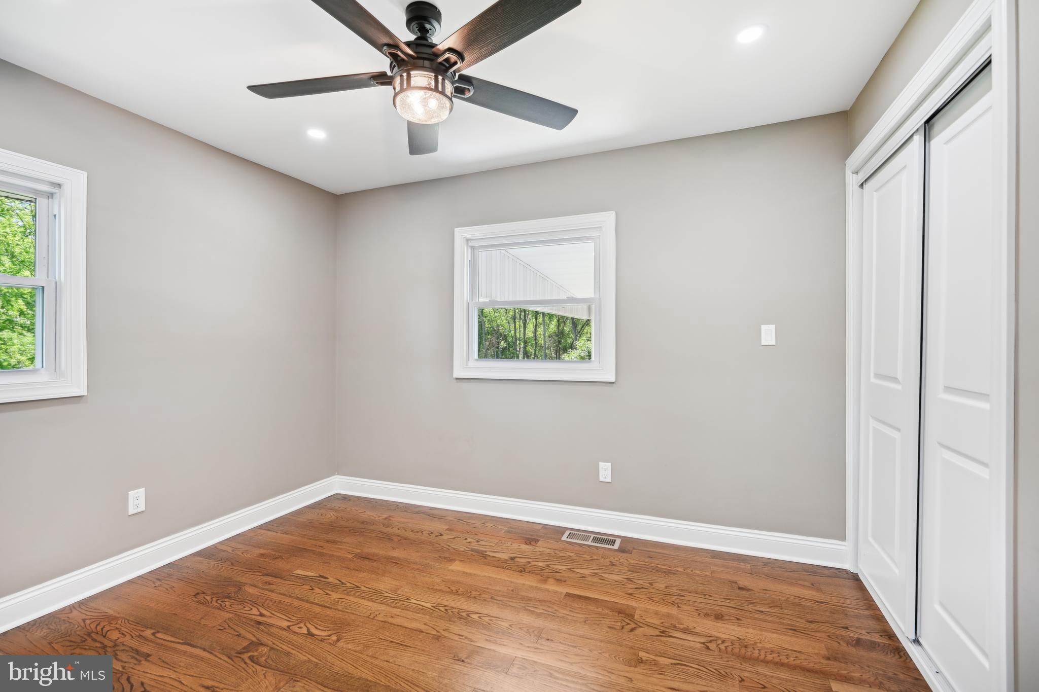 130 Silver Lake Road Bridgeton, NJ 08302 - Photo 26 of 66 an empty room with a window and a ceiling fan