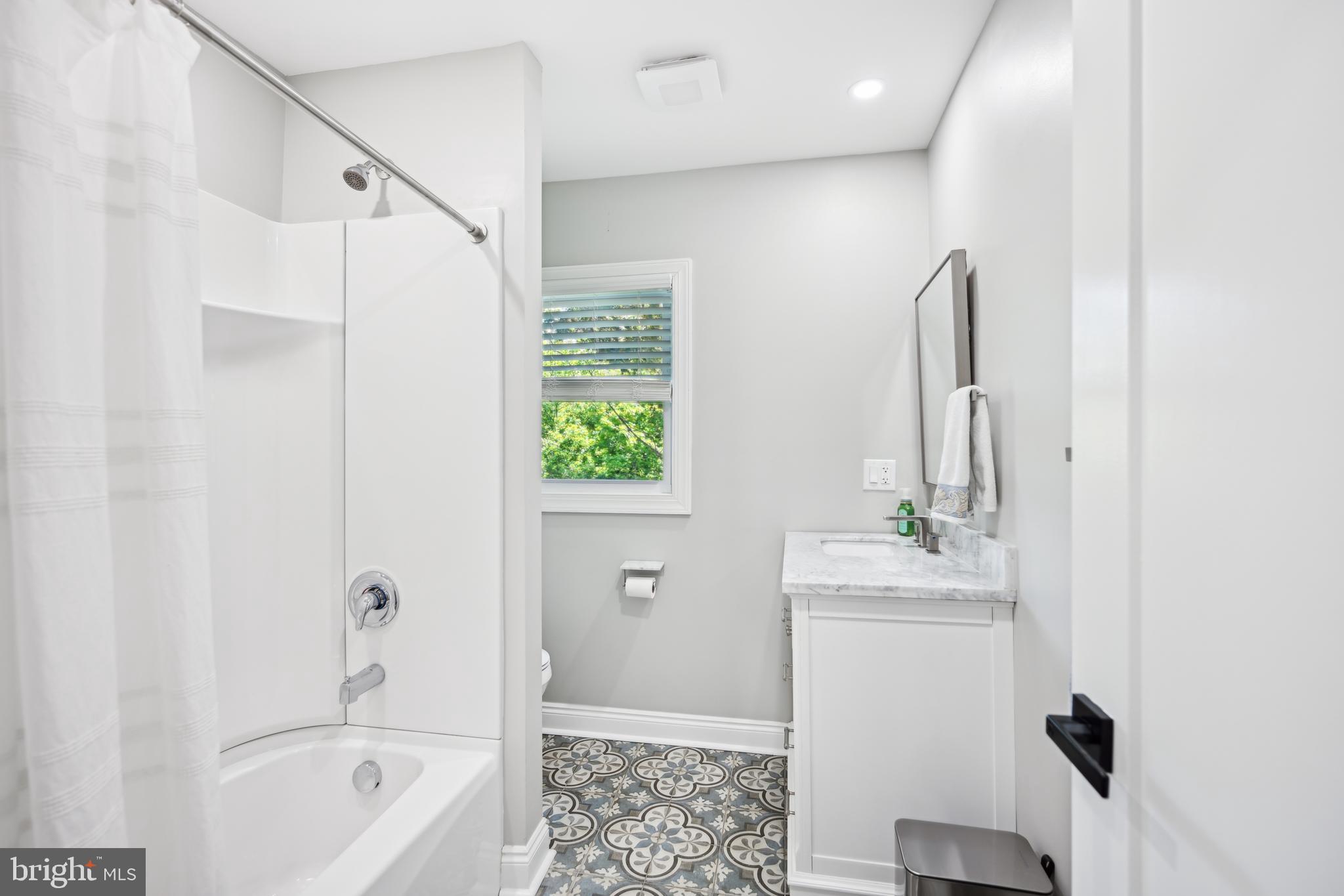 130 Silver Lake Road Bridgeton, NJ 08302 - Photo 32 of 66 a bathroom with a sink a toilet and shower