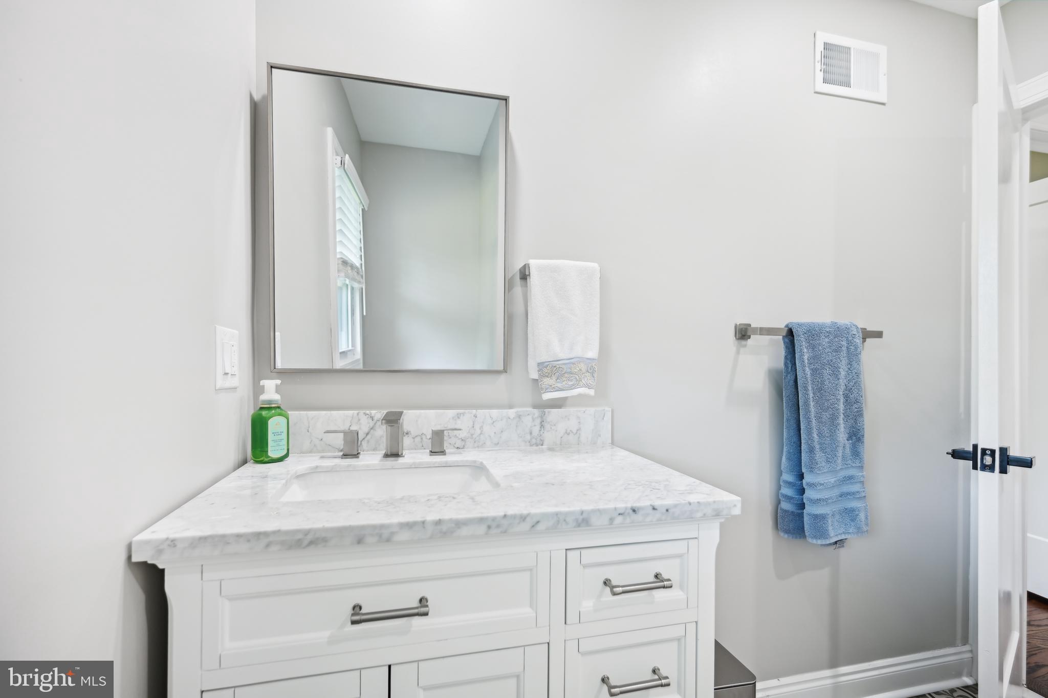 130 Silver Lake Road Bridgeton, NJ 08302 - Photo 33 of 66 a bathroom with a granite countertop sink and a mirror