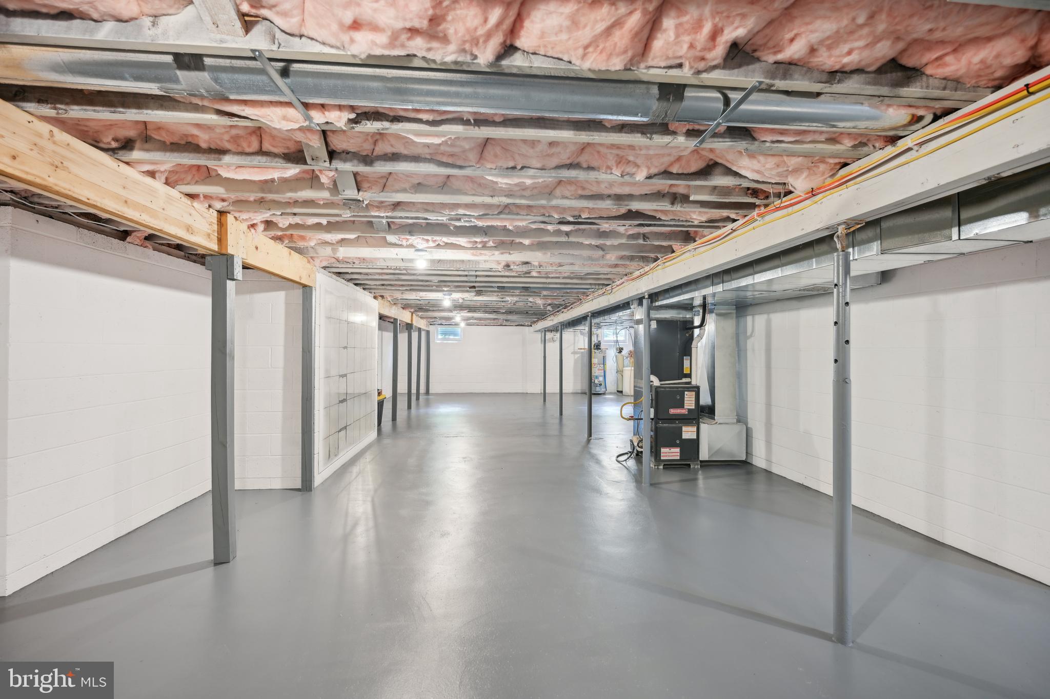 130 Silver Lake Road Bridgeton, NJ 08302 - Photo 36 of 66 a view of a water heater room with wooden floor