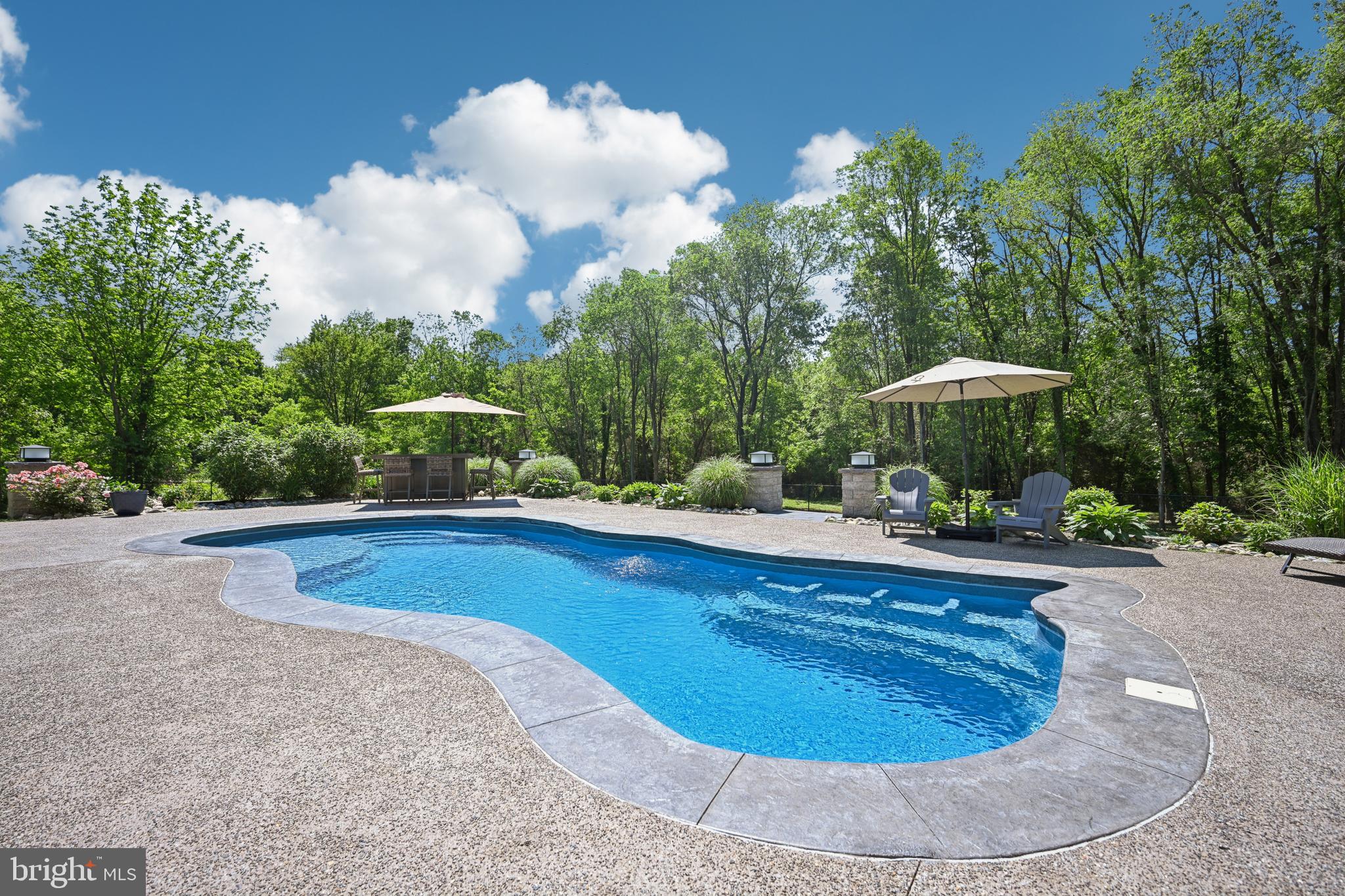 130 Silver Lake Road Bridgeton, NJ 08302 - Photo 38 of 66 a view of a swimming pool with a yard and plants