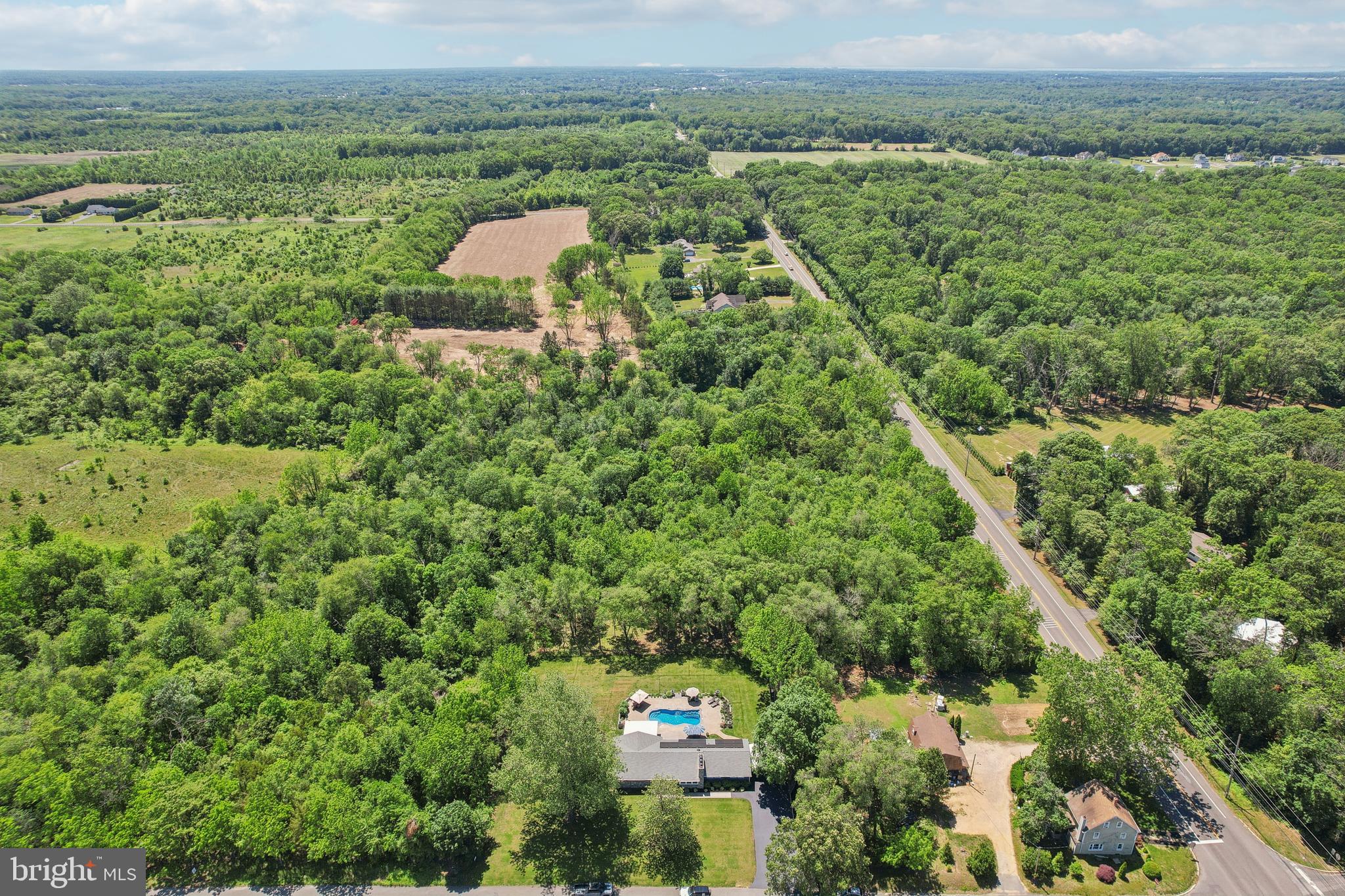 130 Silver Lake Road Bridgeton, NJ 08302 - Photo 57 of 66 an aerial view of a house with a yard and lake view