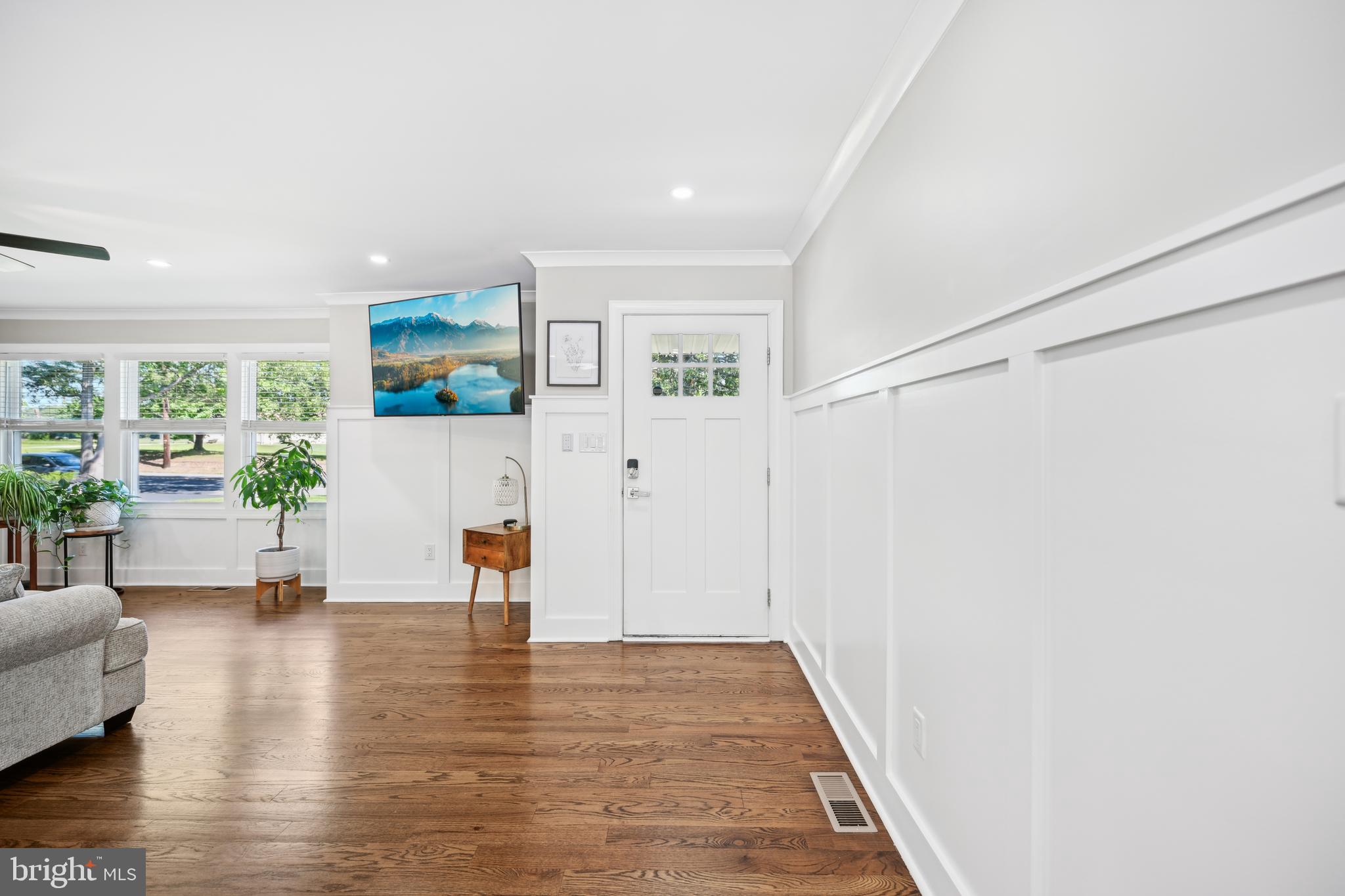 130 Silver Lake Road Bridgeton, NJ 08302 - Photo 9 of 66 a view of an empty room with wooden floor and a window
