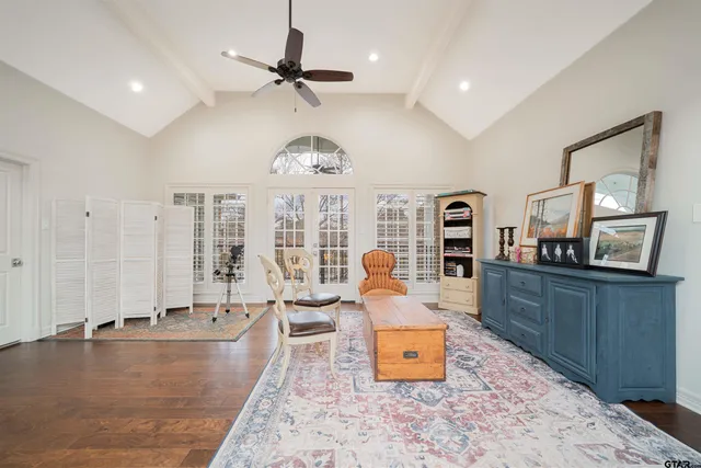 a front view of a house with potted plants
