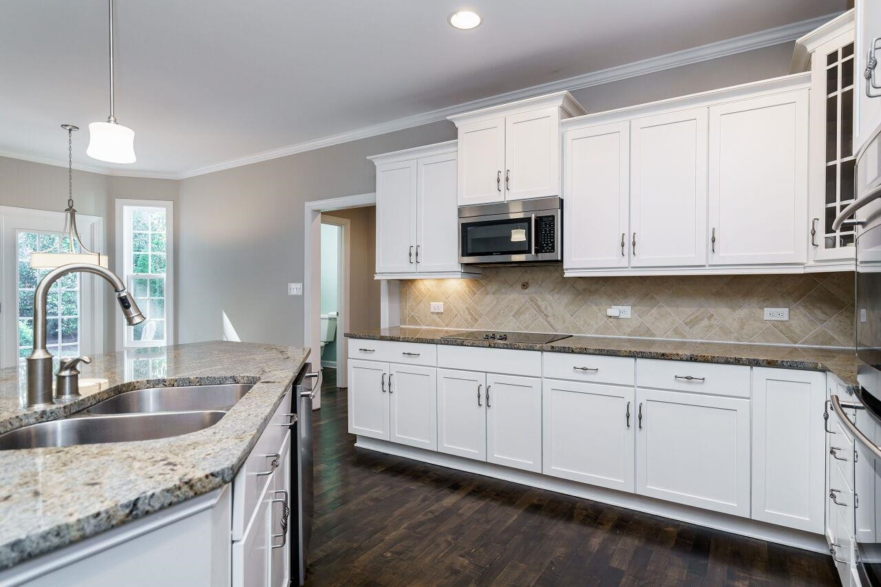 3003 Red Grape Drive Raleigh, NC 27607 - Photo 11 of 35 Plenty of cabinet space along with a generous pantry with all wooden shelving. Kitchen