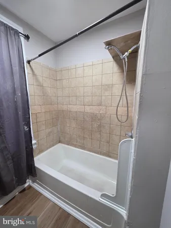 a bathroom with a shower and a bathtub