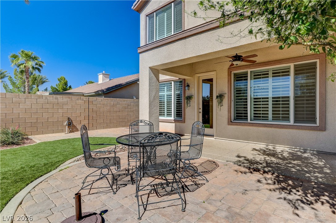 2793 Rosenhearty Drive Henderson, NV 89044 - Photo 67 of 77 A private covered patio with paver flooring creates an ideal outdoor living space.