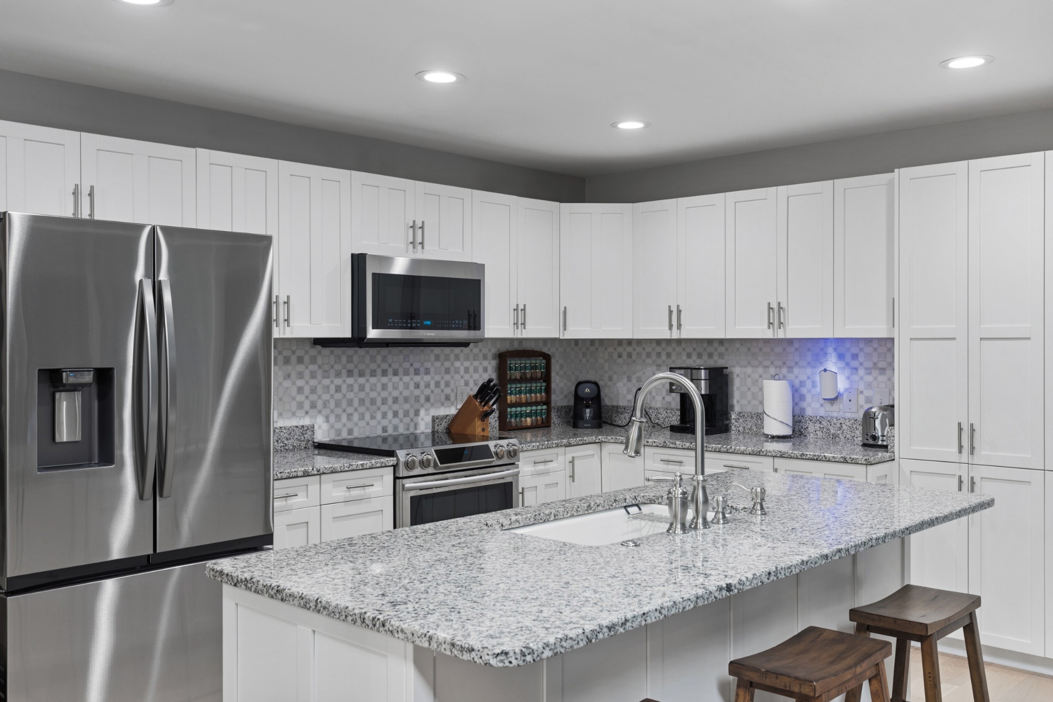 454 Campbell Hollow Road Bethpage, TN 37022 - Photo 22 of 57 a kitchen with kitchen island granite countertop a sink stove and refrigerator