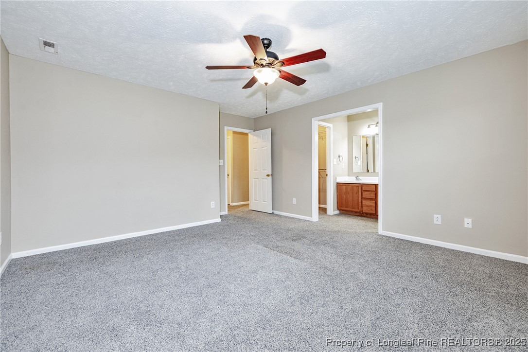 112 Partridge Road Fayetteville, NC 28306 - Photo 21 of 29 a view of an empty room with a ceiling fan and window