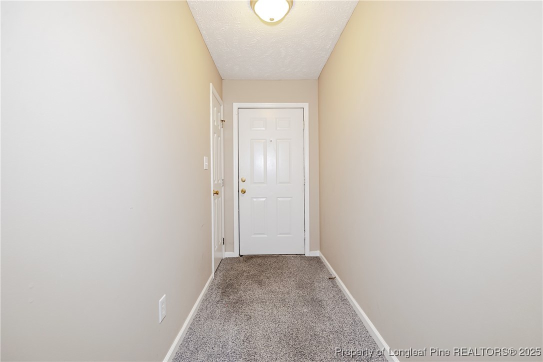 112 Partridge Road Fayetteville, NC 28306 - Photo 4 of 29 a view of a hallway with wooden floor