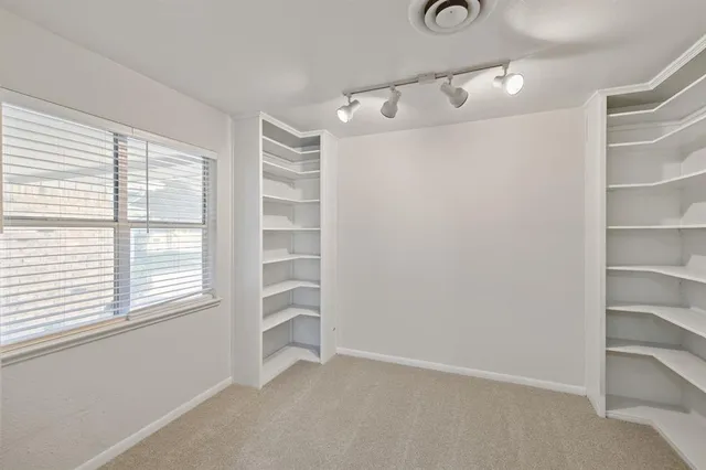 a large kitchen with stainless steel appliances granite countertop a stove and a sink