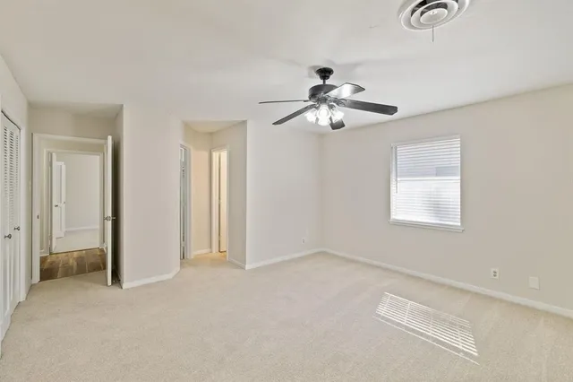 a spacious bathroom with a sink a mirror and a shower
