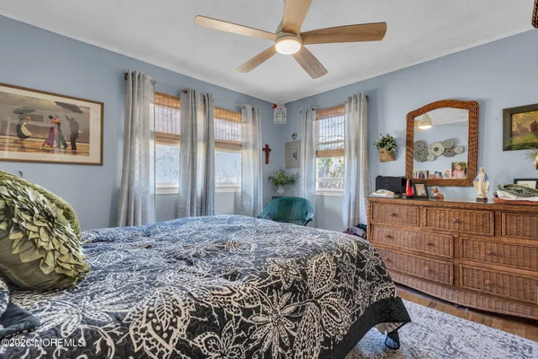 a bedroom with bed and a window