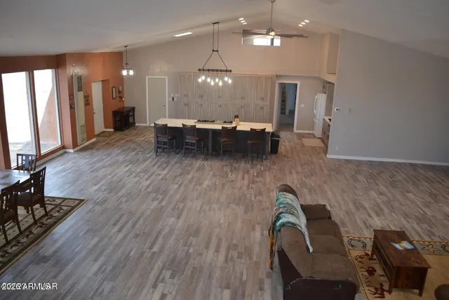 a view of entryway dining room and hall with wooden floor