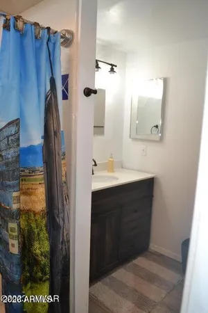 a bathroom with a sink and a mirror