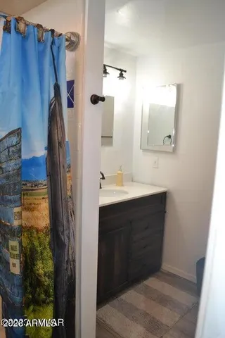 a bathroom with a sink and a mirror