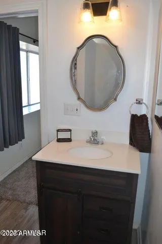 a bathroom with a toilet and a shower curtain