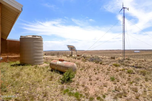 a kitchen with stainless steel appliances granite countertop a sink stove and a refrigerator