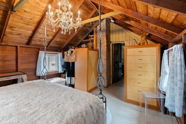 a bedroom with a bed and a closet