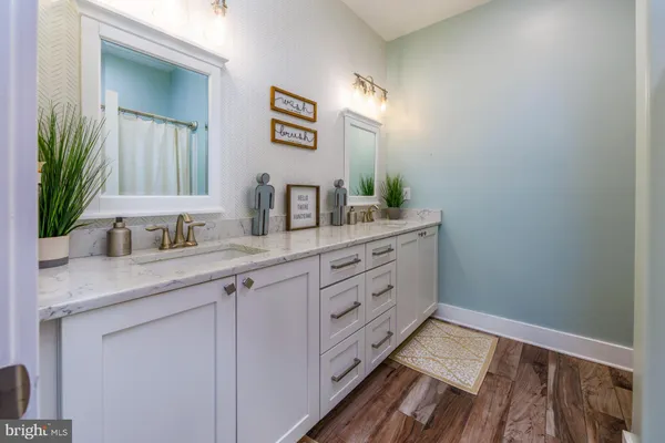 a bathroom with a toilet and a shower curtain