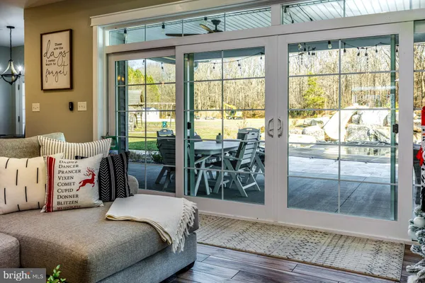 a living room with furniture and windows