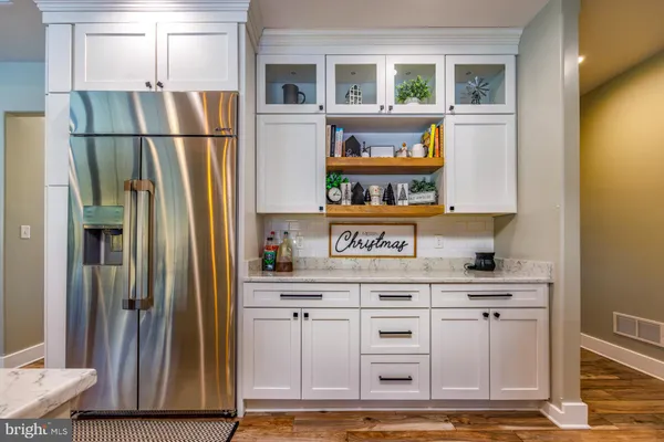 a bathroom with a granite countertop sink mirror and