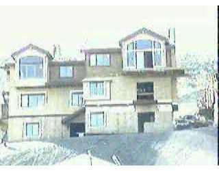 182 Knudson Ranch Road, Unit 24 Edwards, CO 81632 - Photo 1 of 1 a front view of a residential apartment building with a yard