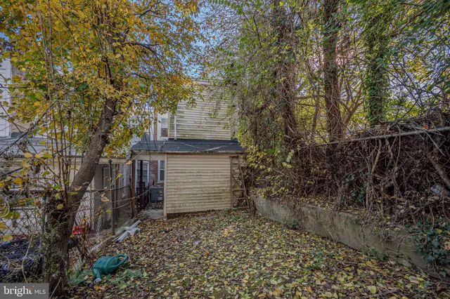 a view of a house with a tree