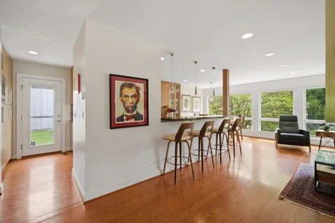 a view of a dining room with furniture window and wooden floor