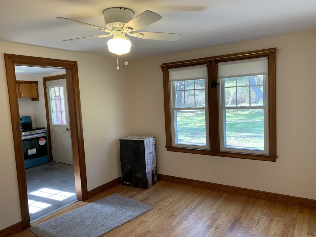 174 Palmer Road Monson, MA 01057 - Photo 8 of 23 a view of an empty room with glass door and a window