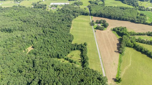 a view of a multi story building with a yard