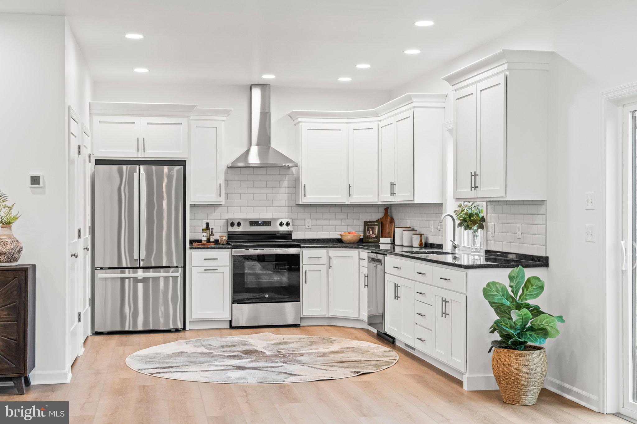 66 Brookview Drive Newport, PA 17074 - Photo 3 of 61 a kitchen with granite countertop a stove a sink and a refrigerator