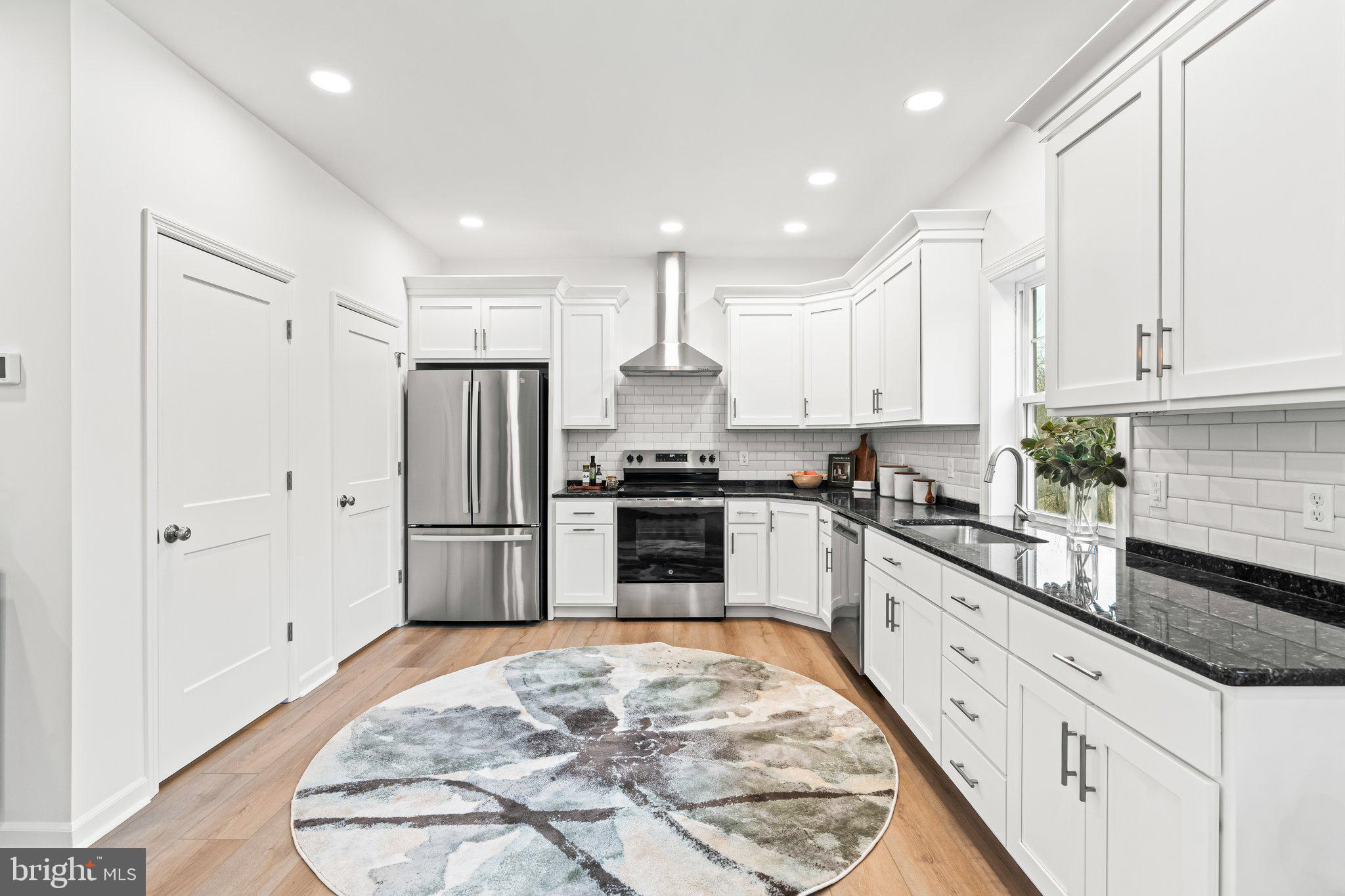 66 Brookview Drive Newport, PA 17074 - Photo 9 of 61 a kitchen with granite countertop a refrigerator and white cabinets