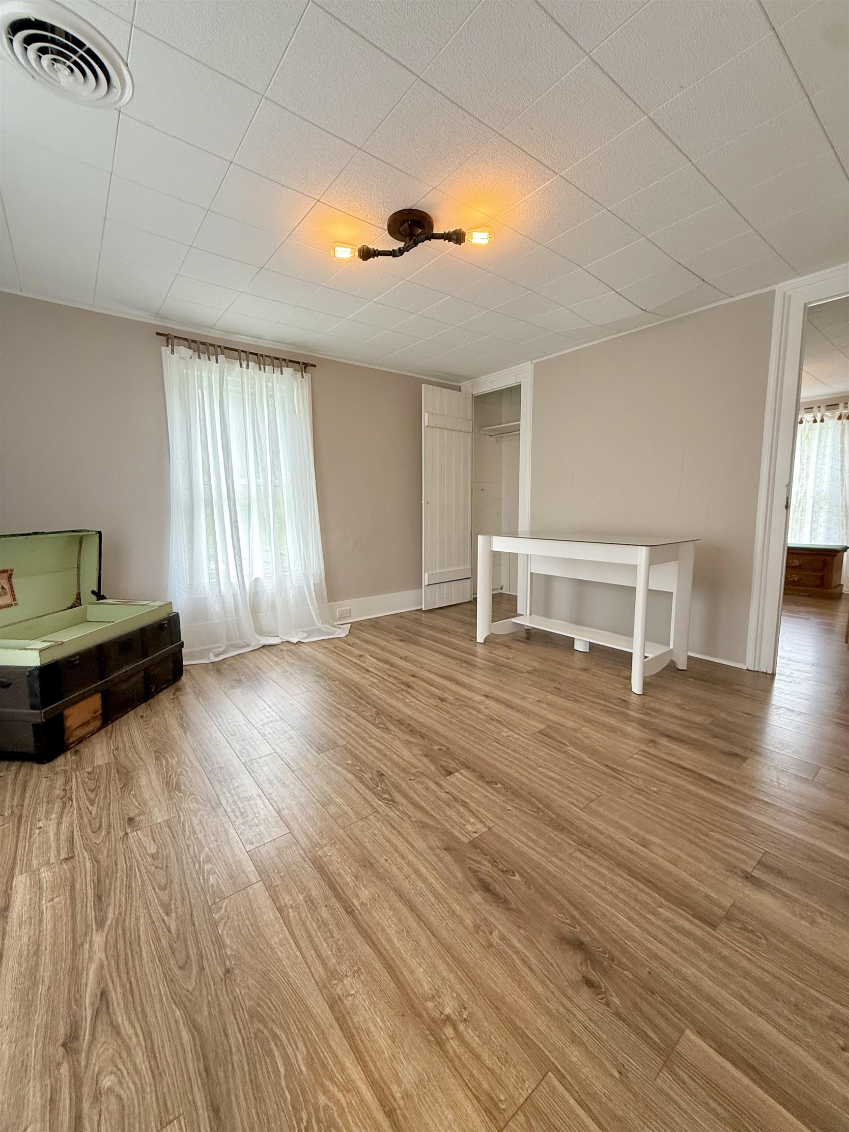 15385 Evergreen Valley Road Timberville, VA 22853 - Photo 30 of 44 a view of empty room with wooden floor and fan