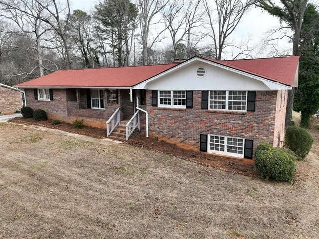 a front view of a house with yard