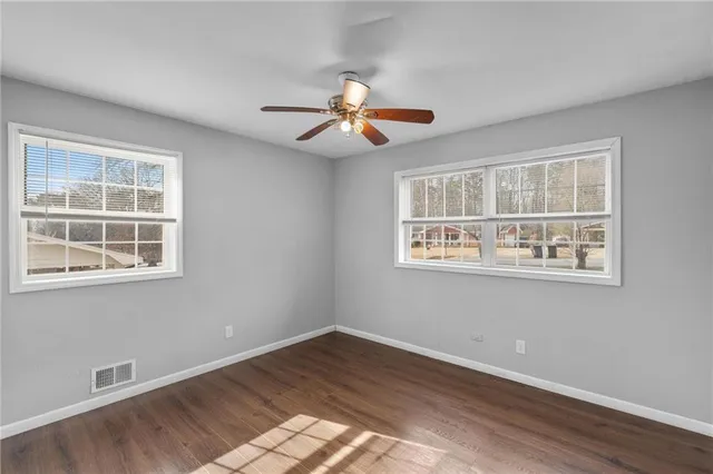 a view of an empty room with a fireplace