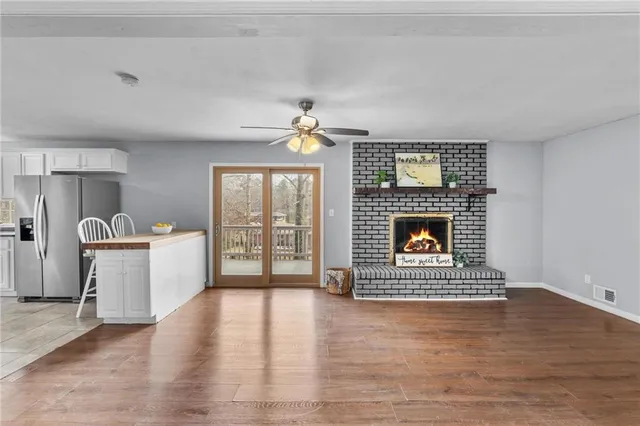 a kitchen with stainless steel appliances a sink stove and refrigerator