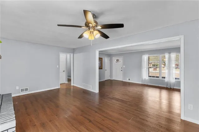 a kitchen with sink and cabinets