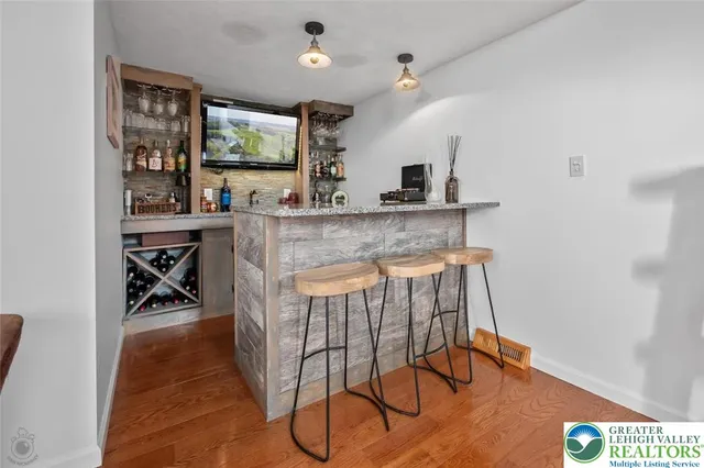 a view of a kitchen with a table and chairs