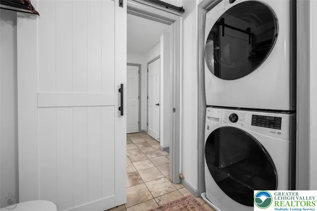 a view of a hallway with washer and dryer