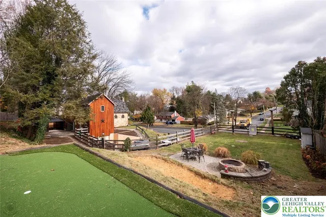 a view of a park with swings and slides