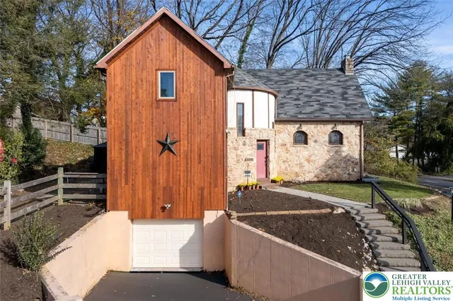 a view of house with backyard